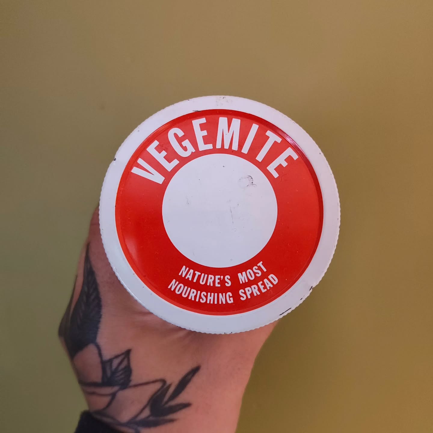 Sarah holding a vintage Vegemite jar